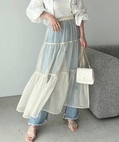 Sheer Organza skirt/see through Frilled Skirt/Women's Skirt/Transparent Skirt/Organza Over skirt/Cocktail Outfit/BeachwearSkirt/Bridal Skirt Sheer full length tulle party or beach skirt very stretchy waist. Over 60 color options Customizable to match your height XS----BUST:- 32, WAIST:-24, HIP:-34 S----BUST:- 34, WAIST:-26, HIP:-36 M----BUST:- 36, WAIST:-28, HIP:-38 L----BUST:- 38, WAIST:-30, HIP:-40 XL----BUST:- 40, WAIST:-32, HIP:-42 XXL----BUST:- 42, WAIST:-34, HIP:-44 Customized Your Size With Us 𝐂𝐚𝐫𝐞 𝐈𝐧𝐬𝐭𝐫𝐮𝐜𝐭𝐢𝐨𝐧𝐬: *Dry Clean only *Do not soak in water 𝐍𝐨𝐭𝐞: 𝐏𝐫𝐨𝐝𝐮𝐜𝐭 𝐜𝐨𝐥𝐨𝐮𝐫 𝐦𝐚𝐲 𝐬𝐥𝐢𝐠𝐡𝐭𝐥𝐲 𝐯𝐚𝐫𝐲 𝐝𝐮𝐞 𝐭𝐨 𝐩𝐡𝐨𝐭𝐨𝐠𝐫𝐚𝐩𝐡𝐢𝐜 𝐥𝐢𝐠𝐡𝐭𝐢𝐧𝐠 𝐬𝐨𝐮𝐫𝐜𝐞𝐬 𝐨𝐫 𝐲𝐨𝐮𝐫 𝐦𝐨𝐧𝐢𝐭𝐨𝐫 Note-If you would like to custom size your dress, pl Layered Skirt Outfit, Skirt Organza, Skirt Over Pants, Frilled Skirt, Bridal Skirt, Boutique Inspiration, Over Skirt, Tulle Maxi Skirt, Bridal Skirts