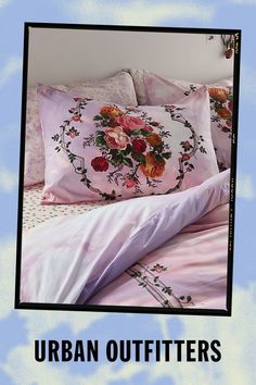 an image of a bed with flowers on it and the words urban outfitters above it