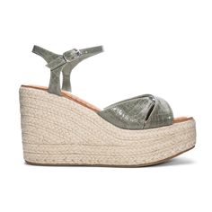 Glide into the season in this trend-centered wedge sandal! The Niamh Wedge Sandal features an ultra-comforting wedge style, an adjustable ankle strap, and a textured snake inspired print throughout. 4" Heel height 2" Platform Ultra comforting sole Trendy Synthetic Wedge Sandals With Textured Sole, Synthetic Sandals With Textured Footbed And Wedge Heel, Trendy Wedge Heel Sandals With Textured Footbed, Chic Adjustable Wedge Sandals With Cushioned Footbed, Chic Adjustable Synthetic Wedge Sandals, Synthetic Wedge Heels With Textured Footbed, Chic Synthetic Wedge Sandals With Textured Footbed, Adjustable Wedge Heels With Cushioned Footbed, High Heel Synthetic Wedge Sandals With Textured Footbed