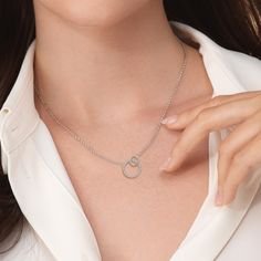 You can't go wrong with this diamond necklace marked with subtlety. Its pendant features a pair of overlapping circles - the big one traced with diamonds and the smaller one in a high-polish finish and off-set layout. The piece possesses a sense of sophistication even in its simplicity, perfect for adding a hint of elegance to your everyday styling. Modern Diamond Necklace With Vvs Clarity, Modern Diamond Round Pendant Necklace, Modern Pave Setting Necklace For Gift, Modern Necklace With Pave Setting For Anniversary, Overlapping Circles, Silver Lab, The Big One, Gorgeous Engagement Ring, Now And Forever