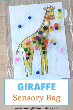 a giraffe is shown in the middle of a bag with pom - poms