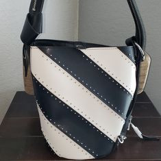 This Is Gorgeous. Black & White Striped Bucket Bag With Silver Studs Along The Seams. Big Chunky Silver Hardware With A Detachable Small White Wristlet Inside. You Can Partially Unzip The Strap And Wear It Like A Backpack. Strap Has An 11 Inch Drop. Leather White Bucket Bag With Zipper Closure, Calvin Klein Bags, Calvin Klein Bag, Calvin Klein Black, Womens Calvin Klein, Silver Studs, Silver Hardware, Bucket Bag, Convertible