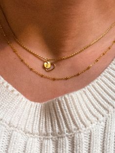 This shimmering Bead Chain necklace effortlessly layers with any chain for a timeless, elegant look. Choose from 16", 18" + 20" | Each necklace comes with a lobster clasp and 2" extender to customize your fit! Available only in 14K Gold Fill. It measures about 1mm in thickness. This beautiful necklace is so simple and elegant - you'll never want to take it off! Every piece is organic and unique — no two Hannah Naomi pieces are exactly alike.Hand-crafted to order in our Portland, OR studio. Dainty Gold Name Necklace With Cable Chain, 14k Gold-filled Cable Chain Necklace For Layering, Gold Heart Pendant Name Necklace For Everyday, 14k Yellow Gold Filled Charm Necklaces For Layering, Everyday Gold Heart Necklace With Cable Chain, 14k Gold Necklaces With Satellite Chain For Layering, 14k Gold Satellite Chain Necklace For Layering, Dainty Necklace With Satellite Chain For Anniversary, Dainty Gold Heart Necklace With Cable Chain