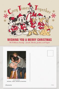 a postcard with an image of mickey and minnie mouses on it, which reads wishing you a merry christmas