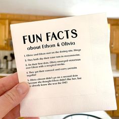 a person holding up a napkin with the words fun fact on it in front of a kitchen