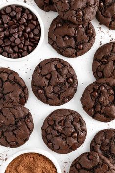 chocolate cookies and cocoa powder in white bowls