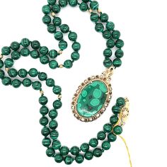 This vintage inspired 25 inch knotted gold bead and malachite necklace is adorned with an oversized 14k yellow gold oval malachite pendant.  the rich green coloring looks like velvet in the sunlight, and is sure to make you feel royal.  Also comes with a 7 inch matching malachite bracelet. Malachite Bracelet, Malachite Necklace, Malachite Pendant, Cameo Ring, Rich Green, Amethyst Cluster, Blue Zircon, Flower Pendant, Cluster Ring