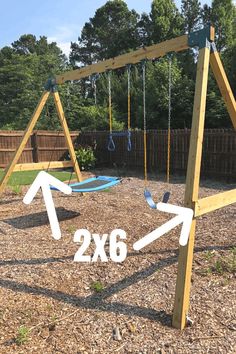 a wooden swing set with two swings in the middle and an arrow pointing to 2x6