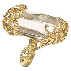 Circa 1980s Ilias LaLaounis 18K Yellow Gold Ring, the top of the ring measures 1 1/8 inches in length and is set with a 6 sided faceted clear Rock Crystal, finished in a free form, modernist style. Finger size 4 1/2. Gold Cuff Ring, Crystal Yellow, Modernist Ring, Head Ring, Cuff Rings, Gold Cuffs, 18k Yellow Gold Ring, Brown Diamond, Champagne Diamond