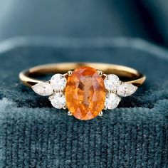 Sunstone Ring, 14k Solid Gold Ring, Orange Sunstone Ring with Moissanite, Engagement Ring, Gift For Her, Natural Sunstone Ring for Women  (in stock) - Metal: 14K Yellow Gold - Custom Color: Rose Gold, Yellow Gold, and White Gold  - Gross weight: 2.33g - Gold Weight: 2.02g - Gemstones: Sunstone, Moissanite - Sunstone CTW: 1.78(1pcs) - Sunstone Size: 5.78*8.04mm - Moissanite CTW: 0.380 (6pcs) - Ring size: 7 - Ring Width: 20.17mm Approximately - Ring Height: 24.09mm Approximate Shipping It usually takes 2-3 weeks to make and 3-5 days to ship We apply a tracking number for every single package. Engraving You can order a custom engraving. (just contact me in advance) Amber Engagement Ring, Sunstone Ring, 7 Ring, Solid Gold Ring, Ring For Women, Ring Size 7, Moissanite Engagement Ring, Gold Yellow, Moissanite Engagement