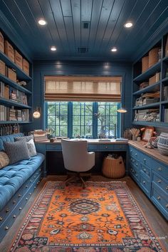 a home office with blue bookcases and an orange rug on the floor in front of it