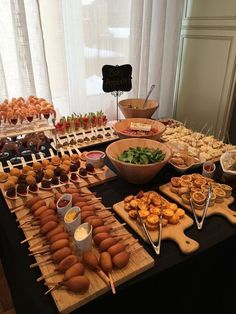 an assortment of food is displayed on a table