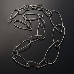 Silver Necklace - Auman refreshes her signature leaf shape in this lightweight, modern necklace. Three large links join a chain of smaller ones, offering a play on scale. Finished with an s-hook style clasp.Necklace is approximately 36 long.  The biggest links are 1 1/4 wide.Available in bright Argentium silver or dark steel. Lightweight Jewellery, Copper Chain Necklace, Silver Wire Earrings, Dark Steel, Turquoise Gold Ring, Signature Bracelet, Mesh Necklace, Modern Necklace, Chain Making