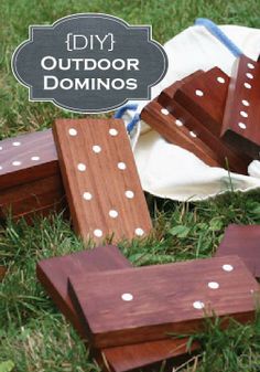 several pieces of wood sit on the ground in front of a white bag with polka dots