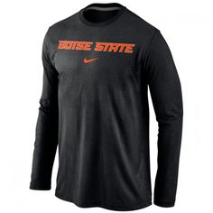 the nike long - sleeved shirt is dark gray with red letters on it, and has