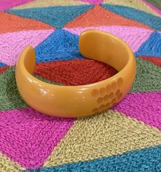 "Beautiful carved butterscotch Bakelite bracelet.  3\" width  7\" around" Handmade Bakelite Bangle Bracelet, Retro Yellow Bangle Bracelets, Vintage Bakelite Bangle Jewelry, Handmade Retro Bakelite Jewelry, Vintage Bakelite Bangle, Bakelite Bracelets, Art Deco Bracelet, Vintage Bakelite, Beautiful Watches