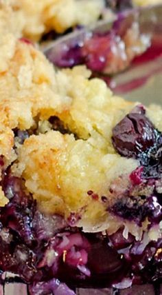 blueberry cobbler with crumbled toppings sitting on top of a table