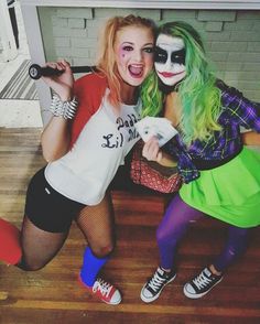 two women dressed as clowns pose for a photo