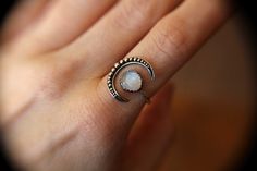 "Very bold large crescent moon moonstone ring! The genuine faceted moonstone measures 8mm and has such wonderful rainbow moonstone quality! This is an open design that has thick 14 gauge sterling silver connecting the 2 independent pieces for strength and durability. The moon has been formed to arch around the finger making this a nice sleek uniform design! Moon measures approx.: 3/4 inch from top to bottom Faceted Moonstone: 8mm 14 gauge band Solid 925 sterling silver ★ IMPORTANT SHIPPING & Bohemian Moonstone Ring With Moon Phase Detail, Spiritual Crescent Moonstone Ring With Moon Phase, Bohemian Moonstone Crystal Ring In Moon Shape, Bohemian Moonstone Moon-shaped Crystal Ring, Moonstone Crystal Ring With Moon Phase, Celestial Moon Shaped Moonstone Crystal Ring, Celestial Moon-shaped Moonstone Crystal Ring, Crescent Moonstone Ring For Gift, Beaded Moon