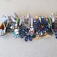 a bunch of hair clips sitting on top of a counter