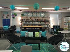 a living room filled with furniture and lots of books on the shelves in front of it