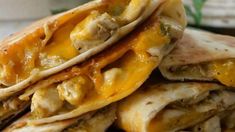 several quesadillas stacked on top of each other with meat and cheese in them