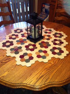 a wooden table with a lantern on top of it