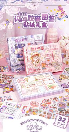 an assortment of japanese stickers on display in front of a pink table with flowers