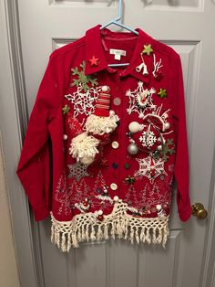 a red jacket with christmas decorations on it