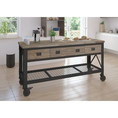 a kitchen island with two drawers on wheels