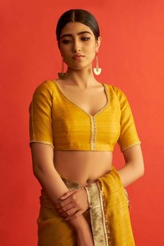 Buy Peach Raw Silk V Neck Meena Zardozi Embroidered Blouse For Women by Mrunalini Rao Online at Aza Fashions. Yellow Blouse Designs, Mustard Yellow Blouse, Saree Blouse Styles, Saree Blouses Online, Blouse Designs Silk, Yellow Saree, Elegant Blouse Designs, Silk Saree Blouse