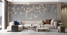 the living room is decorated in neutral colors and features a large floral wall mural on the wall