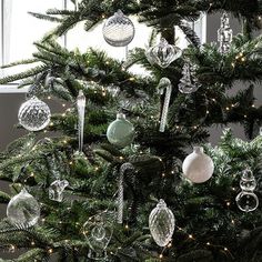 a christmas tree with ornaments hanging from it