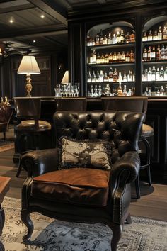 a room with leather chairs and lots of bottles on the shelves