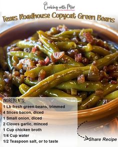 green beans with bacon in a brown bowl on a wooden table next to a recipe card