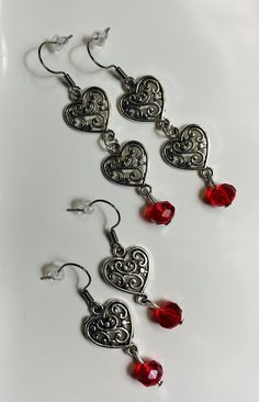 Long Antique Silver Filigree Hearts Dangle Earrings With Crystal Bead And Hypoallergenic Ear Wire - These beautiful, elegant and charming style earrings can give you attention in any gathering Available in 2 sizes: 1- Double Rose - (2.5 inches long) 2- Single Rose - (1.75 inches long) Metal Dangle Heart Earrings With Heart Beads, Metal Heart Dangle Earrings With Heart Beads, Dangle Heart Bead Earrings, Dangle Heart Earrings With Heart Beads, Heart-shaped Dangle Earrings For Valentine's Day, Elegant Heart Beaded Dangle Earrings, Elegant Heart Beads Earrings For Valentine's Day, Elegant Heart-shaped Beaded Earrings For Gift, Valentine's Day Beaded Dangle Earrings