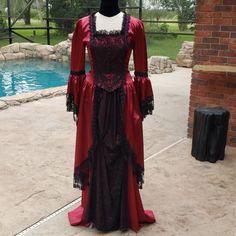 This Just Stepped Out Of An Anne Rice Best Seller! This Deep Red, Almost Burgundy, Romantic Outfit Consists Of 2 Beautiful Pieces. The Long Flowing Front Ruched Skirt And The Corsetted Top Which Goes From Short In The Front To Long In The Back. The Skirt Has An Elastic Waist That Is Both Sturdy And Comfortable. It Has Been Ruched In The Front With A Panel Of Black Lace. It Has A Sweeping Train Perfect To Wear With An Added Bustle Underneath It Or By Itself. The Top Has An Eye Hook Front With A Drawstring Back Giving You The Corset Look Making It Adjustable But Also Very Form Fitting. It Is Not Boned So Like I Said Comfortable. The Long Sweeping Sleeves As Well As The Jacket Itself Are A Red Fitted Gown For Costume Party, Fitted Gothic Gown For Fancy Dress, Red Fitted Victorian Dress For Party, Gothic Fitted Gown For Fancy Dress, Red Fitted Gown For Costume, Fitted Red Gown For Costume, Red Gown For Fancy Dress Occasions, Red Fitted Victorian Dress For Evening, Fitted Red Victorian Dress For Evening