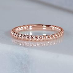 This dainty ring, made in SCS recycled rose gold, is perfectly comfortable for daily wear, as part of a stack, or on its own. Twisted like a piece of traditional nautical rope, it's classic, but never boring. Design Specifications: - Type: Ring - Material: SCS recycled rose gold - Width: 1.8mm - Thickness: 1.5mm - Finish: Polished - Profile: Spiral pattern with sizing bar Gold Ideas, Flush Set Diamond, Inexpensive Jewelry, Dainty Diamond Ring, Gold Rings Simple, Spiral Ring, Nautical Rope, Zierlicher Ring, Hammered Rings