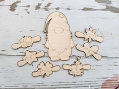 a wooden cutout of a cartoon character surrounded by other wood cut outs and decorations