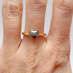 I made five black diamond heart rings in total; this is the fourth largest, weighing in at 1.1 cts. The heart is a natural/untreated rose cut black diamond (salt and pepper) bezel-set in 14k yellow gold. Heart measures apprx. 7.68mm x 8.35mm. Ring size 6. Sizing available Layaway available Heart Cut Ring With Rose Cut Diamonds, Diamond Heart Ring With Rose Cut For Gift, Heart Ring With Rose Cut Diamonds As A Gift, Heart-shaped Diamond Ring With Rose Cut, Gift Heart Ring With Rose Cut Diamonds, Heart-shaped Rose Cut Diamond Ring For Anniversary, Heart Cut Rose Diamonds Heart Ring, Heart-shaped Rose Cut Diamond Ring, Heart Shaped Rose Cut Diamond Ring