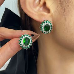 ✰ This delicate lab-created green jewelry is perfect for people who want to achieve a brilliant and splendid look ✰ This oval stud earrings not only suitable for formal occasions such as banquets, weddings, theme parties, but also for everyday wear ✰ This dainty earrings is a very special gift for birthday, Mother's Day, Valentine's Day and more  ✰ Comes with an exquisite gift box We also offer the necklace and ring from the same collection: https://www.etsy.com/listing/1229240980/green-oval-ring-with-halo-green-cz-ring https://www.etsy.com/listing/1242071869/green-oval-pendant-with-halo-green Materials: Environmentally-friendly brass Needle Materials: Silver Quantity: 1 Pair Earring Size: 0.72 x 0.66 in Main Gem Stone Size: 0.37 x 0.28 in ----♛ PRODUCTION & SHIPPING ♛ --- ✰Multiple items Green Round Earrings With Halo Setting, Elegant Green Halo Earrings, Green Halo Earrings For Anniversary, Green Cubic Zirconia Oval Earrings, Green Oval Cubic Zirconia Earrings, Green Oval Earrings For Party, Oval Green Cubic Zirconia Earrings, Elegant Green Earrings With Halo Design, Green Oval Earrings For Anniversary