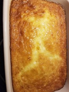 a square piece of bread in a white casserole dish