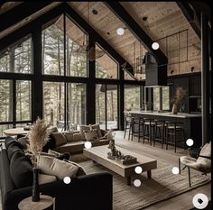 a living room filled with furniture and lots of windows