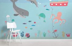 an ocean scene with dolphins and octopuses on the wall