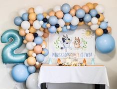 a birthday party with balloons and decorations