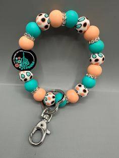 Raise your hand if you are tired of searching in your purse for your keys!  Or if you hate the juggle of your keys being in the wrong pocket and your hands are full!   These bracelet keychains are saving me headaches & eliminating the juggle! The keychain is made of high quality, non-toxic, BPA free silicone beads. Attached to a metal ring and lobster clasp to easily attach to your keys. The wristlet is designed to easily slip onto your wrist, and is the perfect size that it will stay there until you want it off!  No slipping off thanks to the "grippy" silicone beads!  You can then easily reach your keys to unlock the car or house door, but still keep them out of the way and your hands free. CHARM DETAILS: * Silicone Beads * Nylon Cord / Non Elastic / Not Stretchy * Swivel Snap Hook and Ri Skeleton Flowers, Bracelet Keychains, Bracelet Keychain, House Door, Key Accessories, Wristlet Keychain, Metal Ring, Bring Happiness, Silicone Beads