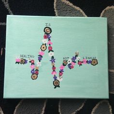 a cross made out of flowers and words on a blue canvas with the word healing