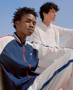 two young men sitting next to each other