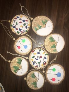 christmas ornaments made out of wooden slices on a table