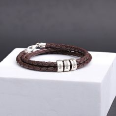 The Ultimate Men's Gift for Your Special Someone!  - "Ideal gift for the Holidays" Expertly handcrafted, this unique bracelet combines genuine leather with customizable 925 silver beads, offering a distinctive and considerate present for your partner, a friend, or a family member.  It's an excellent choice for various occasions including birthdays, anniversaries, Christmas, Valentine's Day, Father's Day, and more. ★ ITEM DETAILS: * Materials: Genuine Leather   *  925 Sterling Silver Charms and C Adjustable Jewelry For Father's Day Personalized Gift, Adjustable Name Bracelet For Birthday And Father's Day, Personalized Bracelets For Birthday Gift On Father's Day, Father's Day Gift Bracelets With Engraved Text, Father's Day Bracelet With Engraved Text As Gift, Father's Day Gift Bracelet With Engraved Text, Father's Day Bracelet With Engraved Text, Adjustable Jewelry With Engraving Option For Birthday Gift, Father's Day Gift Bracelets With Engraving Option